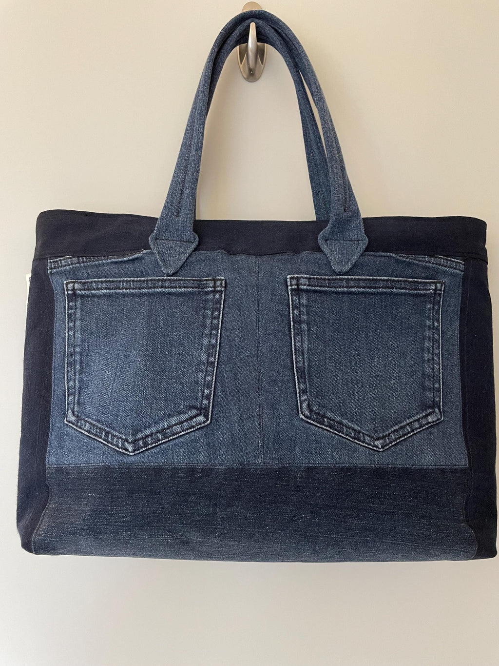 Handmade recycled zip top patchwork denim tote bag with aquarium fabric lining