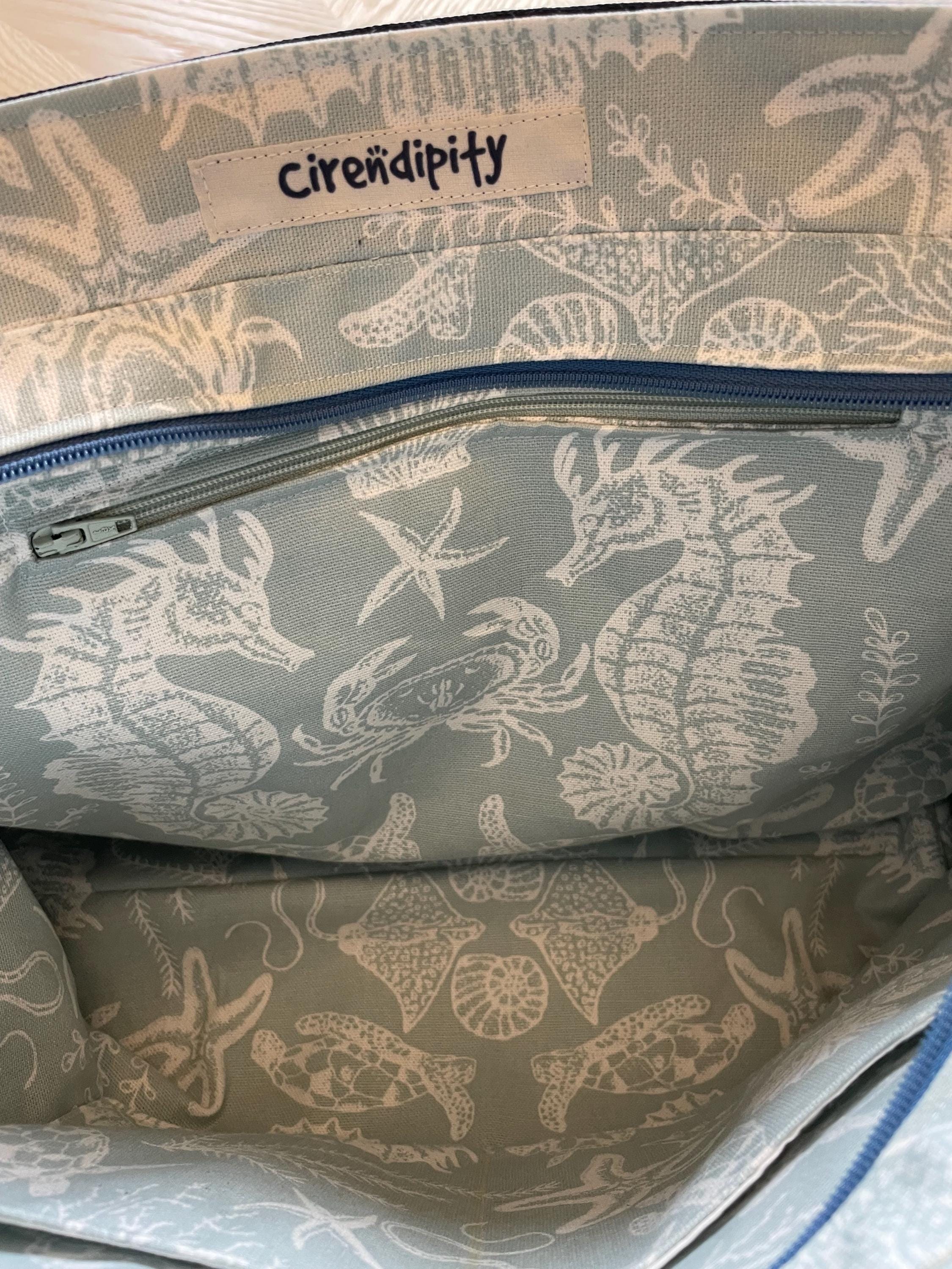 Handmade recycled zip top patchwork denim tote bag with aquarium fabric lining