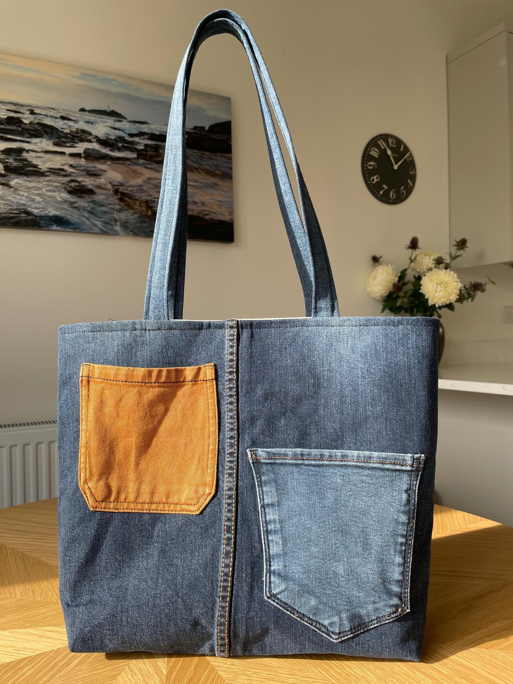 Handmade recycled patchwork denim tote bag with Sophie Allport bees fabric lining