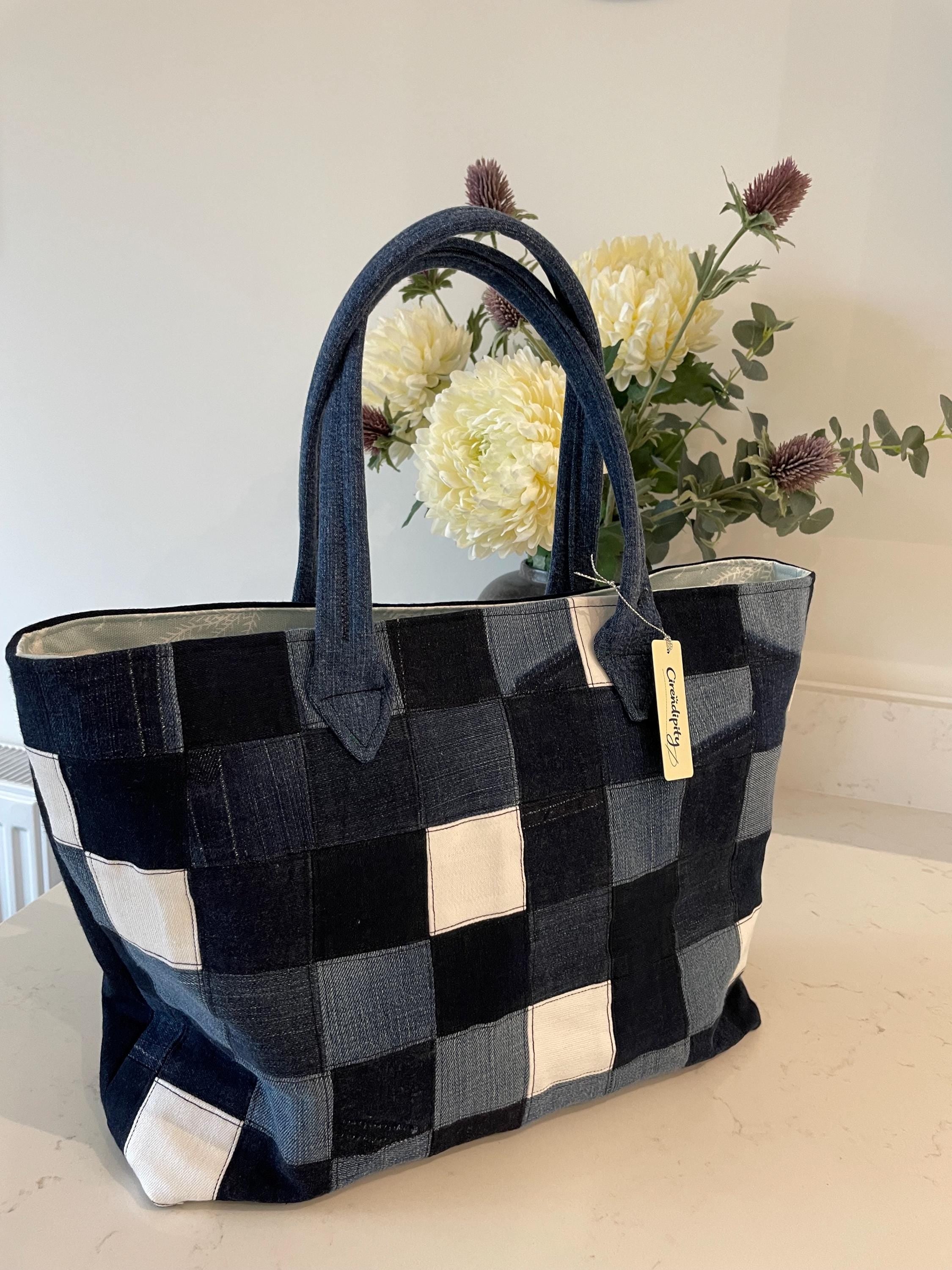 Handmade recycled zip top patchwork denim tote bag with aquarium fabric lining