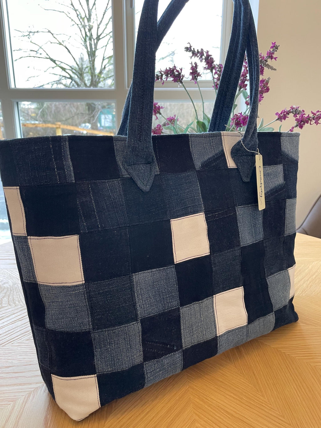 Handmade recycled zip top patchwork denim tote bag with aquarium fabric lining
