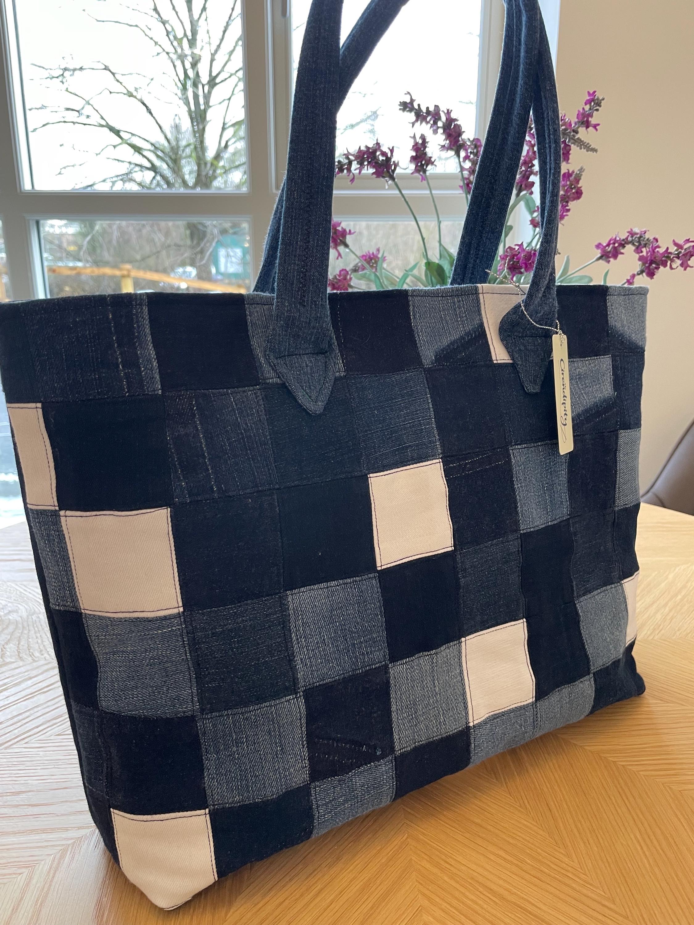 Handmade recycled zip top patchwork denim tote bag with aquarium fabric lining